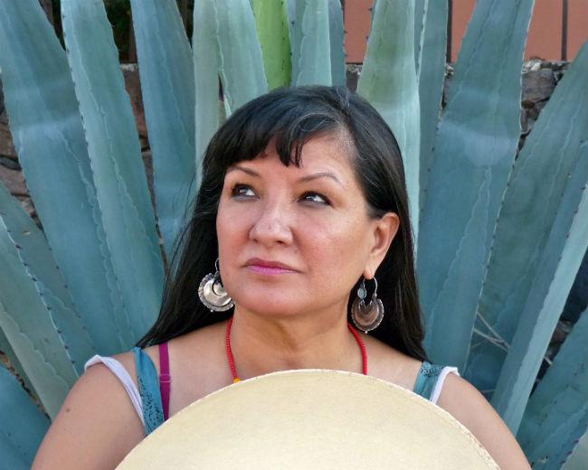 Woman standing in front of cactus Woman standing in front of cactus